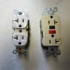 A regular outlet. The white one will not be acceptable - the ivory one on the right is what you will need. A common 20 amp GFCI outlet, just like the ones in your kitchen.