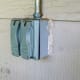 A double gang box surface mounted on wood siding. Not an RV outlet - it has a light switch and a 20 amp outlet inside.