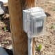 Surface mounted on a post bordering a driveway. Not an RV outlet.