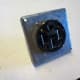 One type of mounting plate, with a 50 amp outlet mounted in it. This one is suitable for a surface mounted box, but not a flush mounted one.