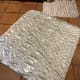 Two sizes of Pouch Pads, with doggie print. The large one is about 3 1/2 feet by 4 feet.