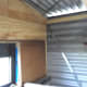 One wall insulated. Metal strapping provides additional strength for the structure in high winds.