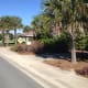 A typical scene in The Villages: palm trees and sunny streets. Many people find the development idyllic and believe that the advantages vastly outnumber the disadvantages, but others are more critical.