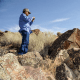 Rupert Steele, of the Confederated Tribes of the Goshute Reservation, takes a photo during a tour of a petroglyph site in Box Elder County, Utah, Aug. 26, 2016.