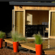 This cottage with vertical cedar exterior and optional porch is a real charmer.