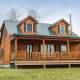 The Homestead features a large second story with loft, and two gabled dormers. Invoking Cape Cod, this full-featured but rustic design starts at $231,174 for a 3-bed, 2-bath design.