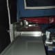 Optional kitchen sink and bench space that extends out from the rear of the trailer beneath part of the tent ... and folds into the trailer when you pack up to move.