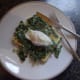 Poached egg with spring greens on toast.