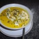 Homemade curried parsnip soup with croutons.