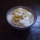 Bowl of porridge with banana and yoghurt.