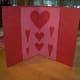 Then, when the card is opened, there will more hearts.