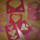 Save the papers you cut the hearts out of. You can paste them on the outsides and insides of your cards.