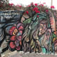 I liked how they integrated the wall mural into the rose bush that was growing. Simply beautiful