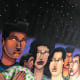 One side of the tunnel art had a blue sky and people appeared in awe of the stars above. The other side featured a dark sky with people looking more fearful and distrustful of one another.