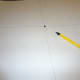 Divide the poster board into fourths and then draw a circle in the middle.