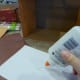 Then we chose a pretty scrapbook paper in a burlap texture pattern to glue onto the inside . . .