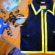 Use a hot glue gun to attach yellow ribbon along the edge and collar of the vest.