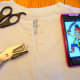 Cut a slit down the center of the collar and punch 2 holes on each side.