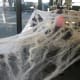 How about decorating a friend's cubicle with spider webs left over from Halloween decorations?