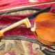 I first unstrung the violin and removed the neck and tail piece.