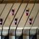 Two broken black keys put back in place, keys No. 58 and 60, repairs barely visible