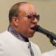 The lead singer of the group Touch'e of Clazz has a tremendous voice and works diligently during their performance.