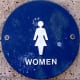 A female symbol usually means the restroom will have closed stalls for privacy, a baby station, and probably more handicap accessible facilities.