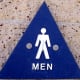 A male symbol usually means the restroom will have urinals. There may or may not be closed stalls for privacy, and there probably aren't baby changing stations.