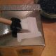 Use glue or Mod Podge to attach to the box.