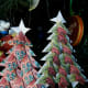 The star is the first few steps of the crane origami fold. Use puff balls or small buttons instead.