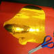 Bell yellow foil on cardboard to be cut out.