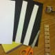 Cut white strips of cardstock to fit around your child's head.