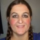 Rosy cheeks and eye makeup.