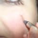 Drawing the cracks on my face.