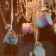 Hanging small teacups from a chandelier is such a lovely idea!