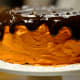 A luscious chocolate topping and a unique flavor (pumpkin) enhance this simple cake.
