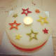 A birthday cake decorated with stars.