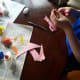 Cut out bunny ears from pink construction paper.