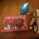 Save the cards from earlier years and cut off the colorful pictures. You can use simple brown paper wrapping which sets off the holiday card nicely. For small gifts, reuse paper saved from last year, cut down to smaller size to remove the tape marks.