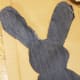 Once the ear is at the desired level of plushness, hot glue the two sections together to create a seam.