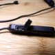 ACIL H2 Bluetooth Earbuds controller with USB charging input exposed