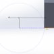 Placing the center of the Centerpoint Arc right on the Point we defined, then defining the radius by clicking on the lowest point of the part