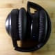 iTeknic active noise canceling headphones folded for storage