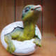 Red cyan 3D stereoscopic picture of a dinosaur coming out of an egg.