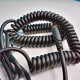 The Vogek Over-Ear DJ Headphone's lead is partially composed of curly cord