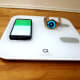 Arboleaf scale pictured with a smartwatch and a cellphone