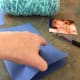 Fold paper in half so there is a crease in the middle to use as a guide.
