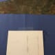Place the picture in the center of the paper using the crease as a guide. Trace around it with pencil.