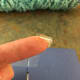 You can also roll a tiny piece of tape to hold the edges down better.