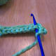 Hook goes through both loops of V.
